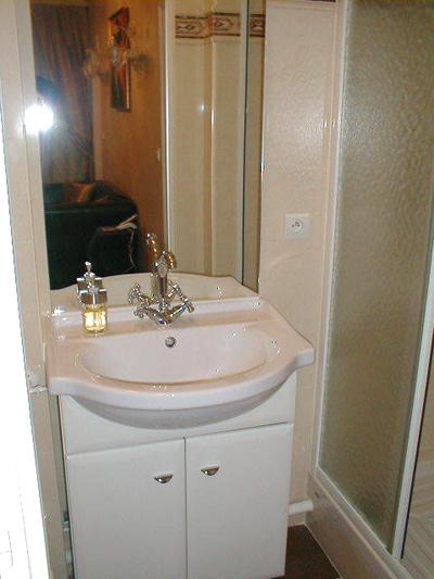 Paris apartment has a spacious wash basin and great lighting.