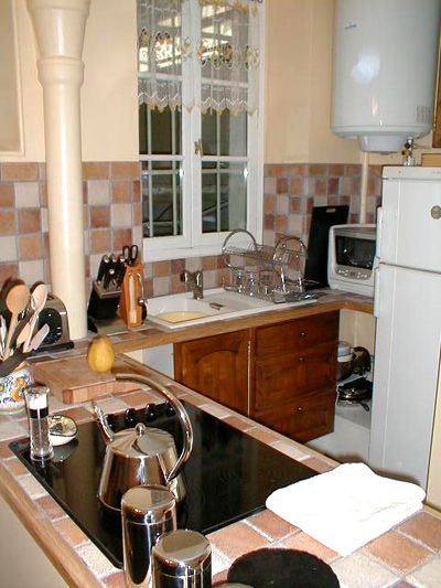 Paris apartment has a full kitchen with everything you'll need to prepare real French meals.